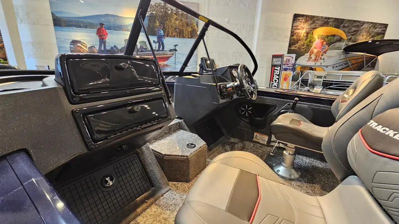 Slide: The Image of Interior of 2025 Tracker Targa V-19 WT boat with modern dashboard and seating. - 3