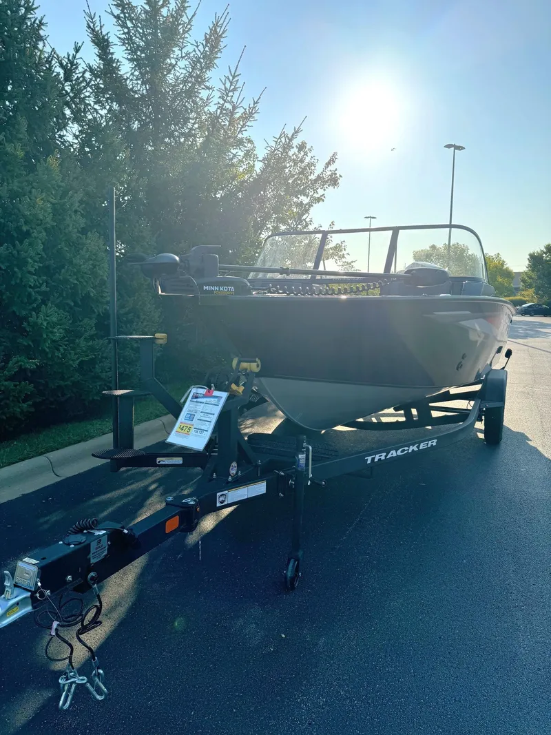 Slide: The Image of 2025 Tracker Targa V-19 Combo boat on trailer in sunny outdoor setting. - 2