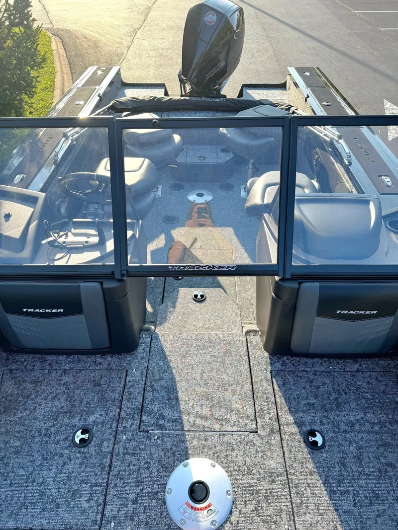 Slide: The Image of 2025 Tracker Targa V-19 Combo boat interior with seating and steering console. - 4