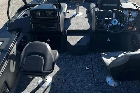 Slide: The Image of 2025 Tracker Targa V-19 Combo boat interior with steering wheel and seating. - 2