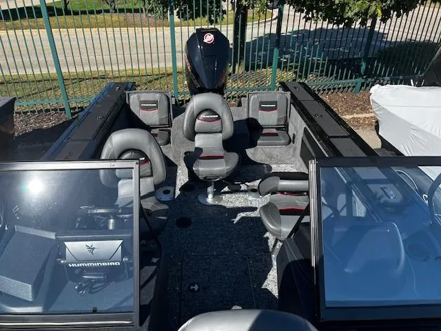 Slide: The Image of 2025 Tracker Targa V-19 Combo boat interior with seating and Humminbird electronics. - 3