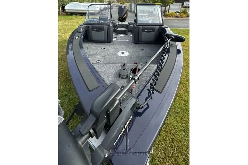 Slide: The Image of 2025 Tracker Targa V-19 WT boat with trolling motor on grassy area. - 10