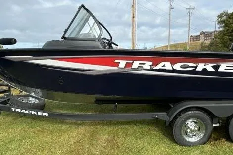 Slide: The Image of 2025 Tracker Targa V-19 WT boat on trailer, side view with logo. - 11