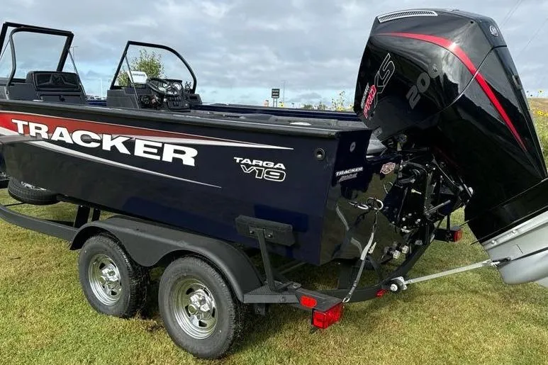 Slide: The Image of 2025 Tracker Targa V-19 WT boat on trailer with powerful outboard motor. - 13