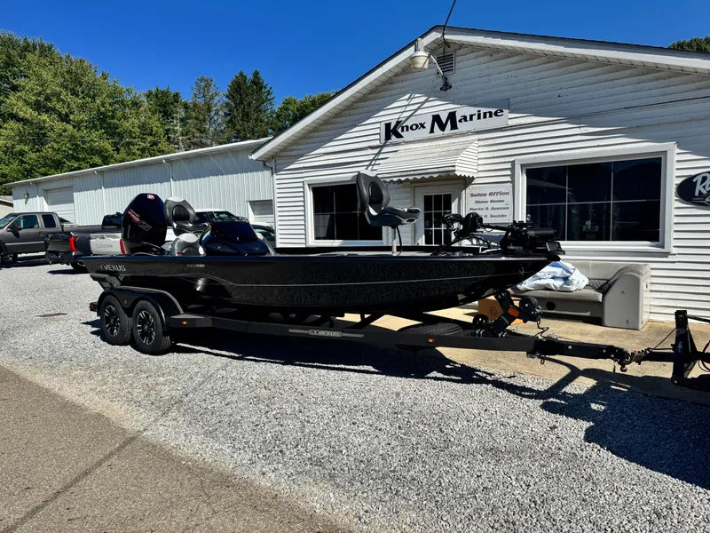 Slide: The Image of 2025 Vexus AVX2080 boat on trailer outside Knox Marine dealership. - 2