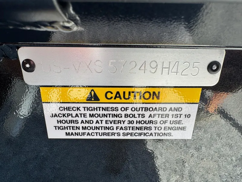 Slide: The Image of Caution label on 2025 Vexus AVX2080, advising bolt checks for outboard and jackplate. - 4