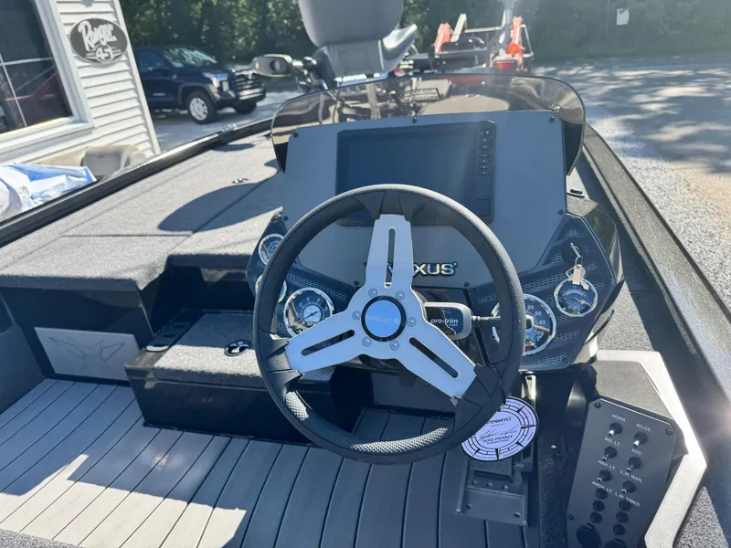 Slide: The Image of Steering console of 2025 Vexus AVX2080 boat with modern controls and dashboard. - 5