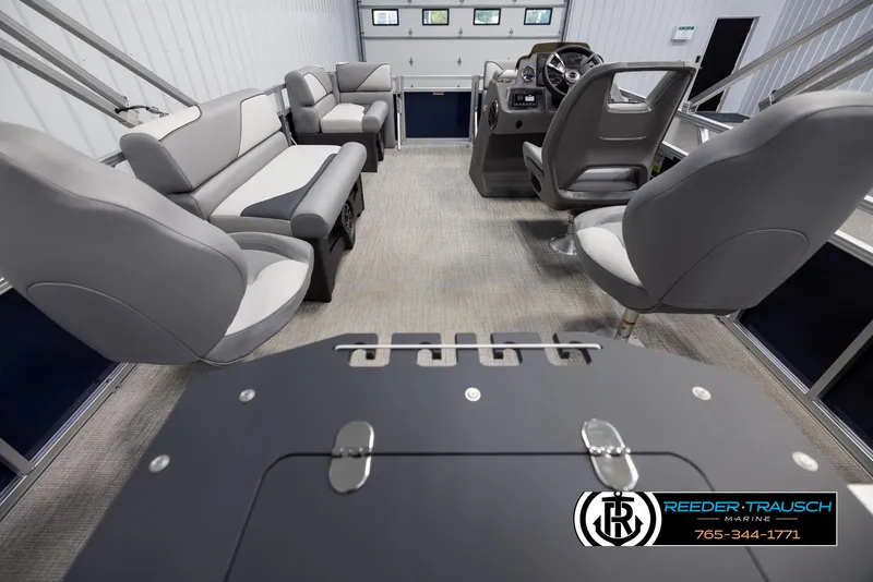 Slide: The Image of Interior of 2025 Avalon VEN RF boat with modern seating and steering console. - 16