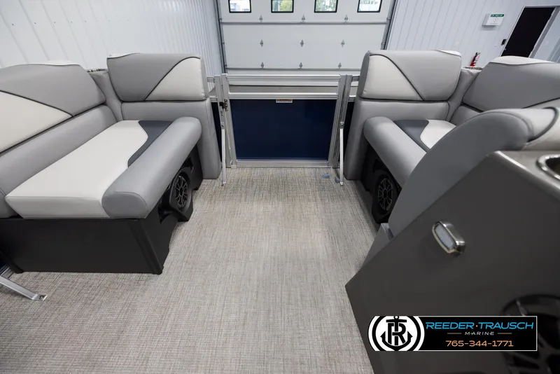 Slide: The Image of 2025 Avalon VEN RF boat interior with gray seating and carpeted floor. - 18