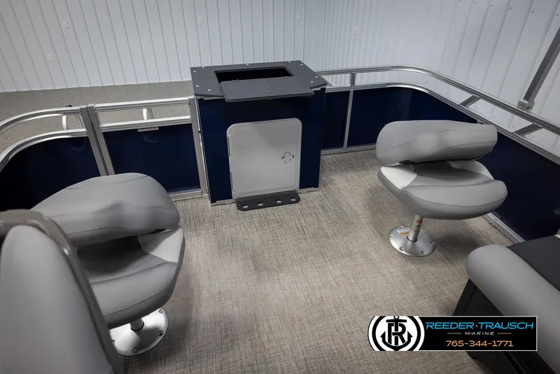 Slide: The Image of 2025 Avalon VEN RF boat interior with gray seating and carpeted flooring. - 23