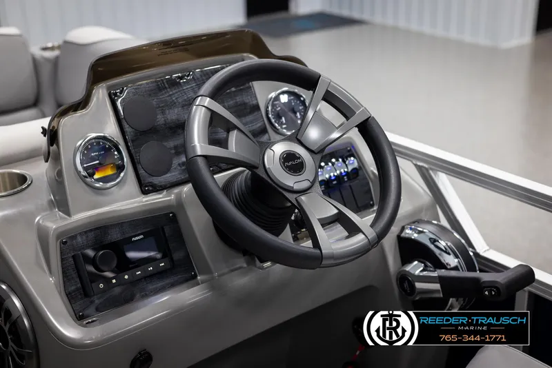 Slide: The Image of 2025 Avalon VEN RF boat dashboard with steering wheel and control panel. - 25
