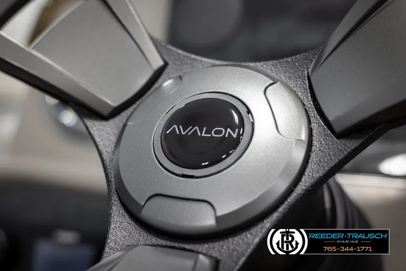 Slide: The Image of Steering wheel of 2025 Avalon VEN RF with logo, close-up view. - 26
