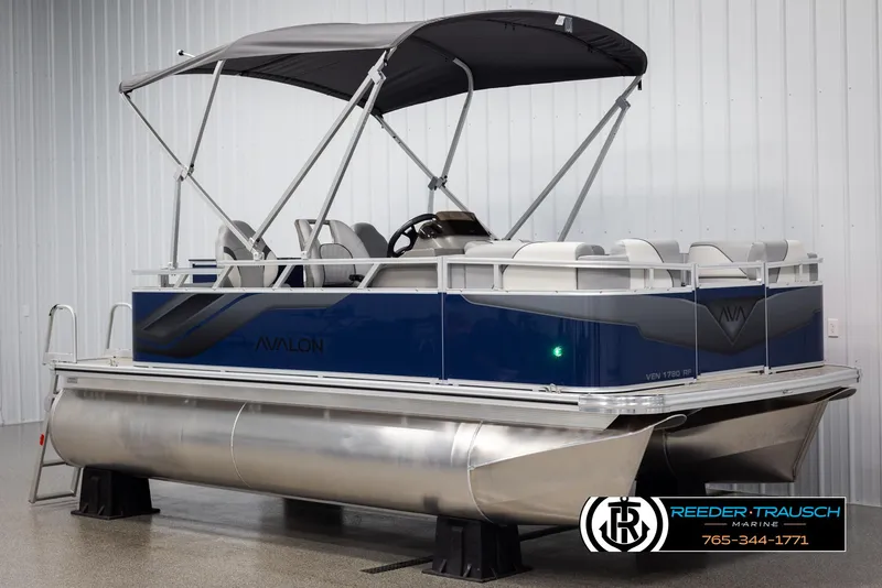 Slide: The Image of 2025 Avalon VEN RF pontoon boat with canopy in showroom. - 3
