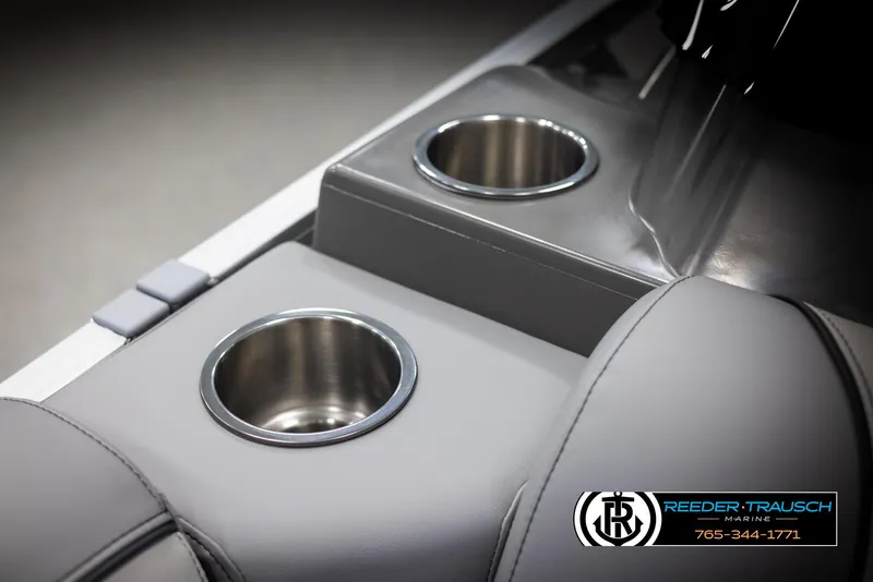 Slide: The Image of Avalon VEN RF 2025 boat interior with dual cup holders, gray upholstery. - 34