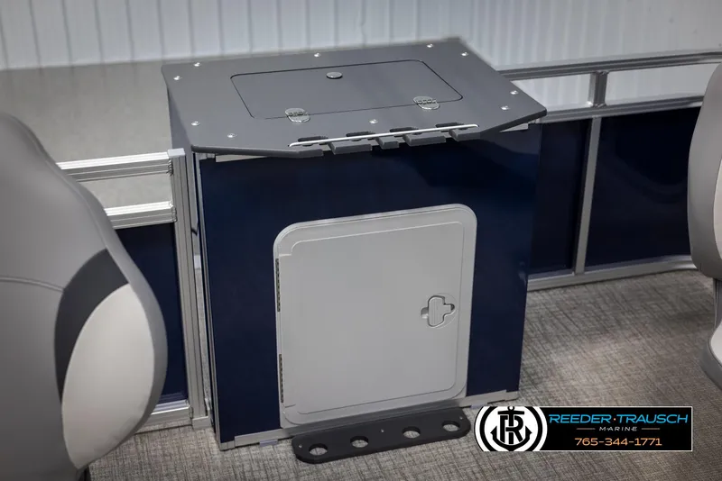 Slide: The Image of Interior of 2025 Avalon VEN RF boat, featuring a storage compartment and seating. - 35