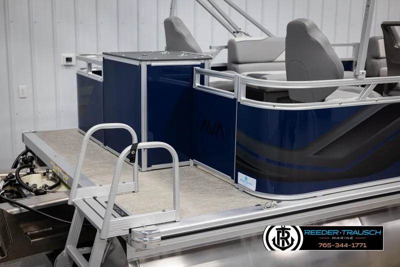 Slide: The Image of 2025 Avalon VEN RF boat with blue exterior and seating, displayed indoors. - 42