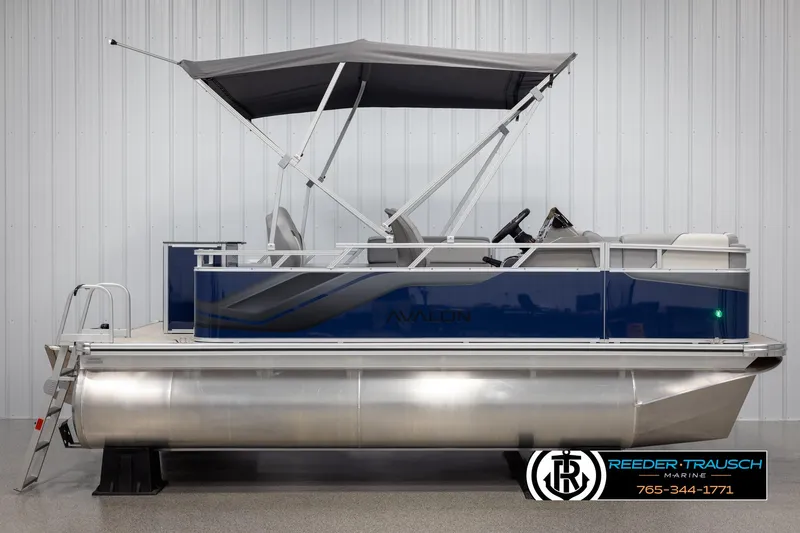 Slide: The Image of 2025 Avalon VEN RF pontoon boat with canopy in showroom. - 5