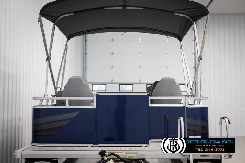 Slide: The Image of Avalon VEN RF 2025 pontoon boat with canopy in showroom. - 7