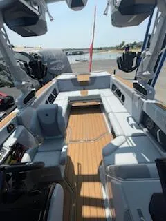 Slide: The Image of 2024 Nautique GS24 boat interior with spacious seating and modern design. - 12