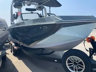Slide: The Image of 2024 Nautique GS24 boat on trailer, sleek design, outdoor display. - 3