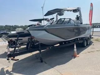Slide: The Image of 2024 Nautique GS24 boat on trailer at marina. - 9