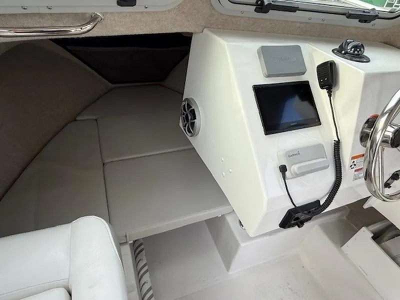 Slide: The Image of 2025 Parker 2120 Sport Cabin interior with modern controls and comfortable seating. - 12