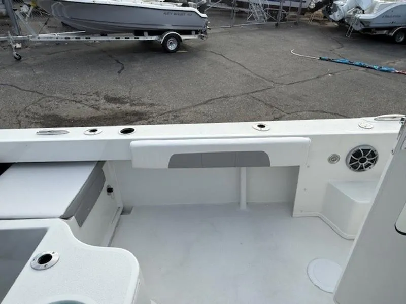 Slide: The Image of 2025 Parker 2120 Sport Cabin boat interior with seating and storage compartments. - 9