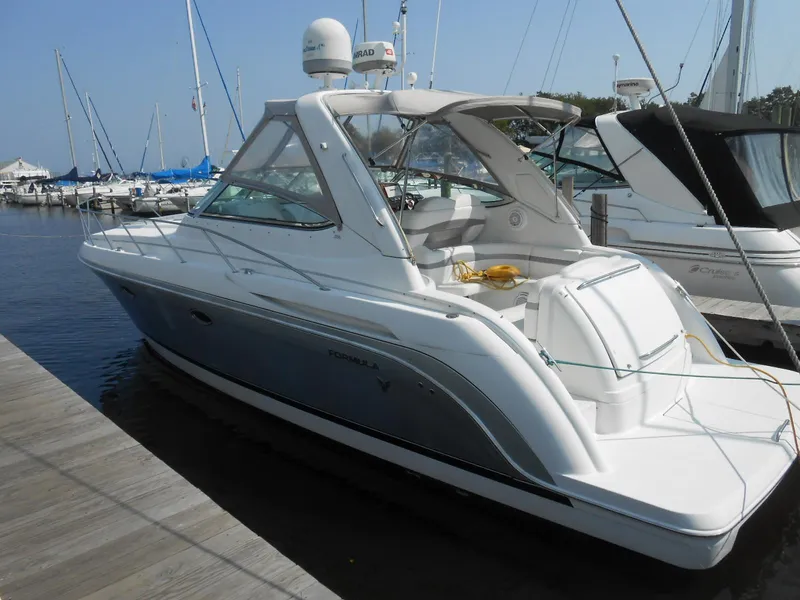 The Image of 2004 Formula 37 PC yacht docked at marina, featuring sleek design and spacious deck. - 0
