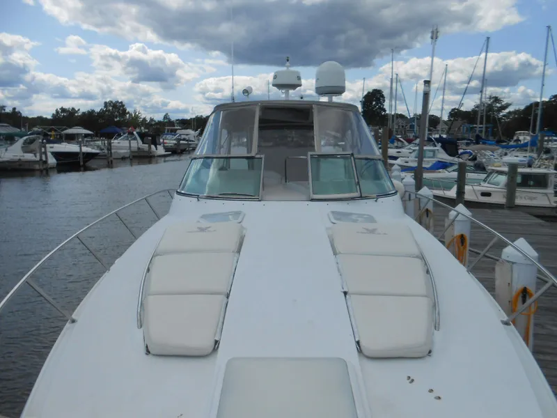 Slide: The Image of 2004 Formula 37 PC yacht docked at marina under cloudy sky. - 12