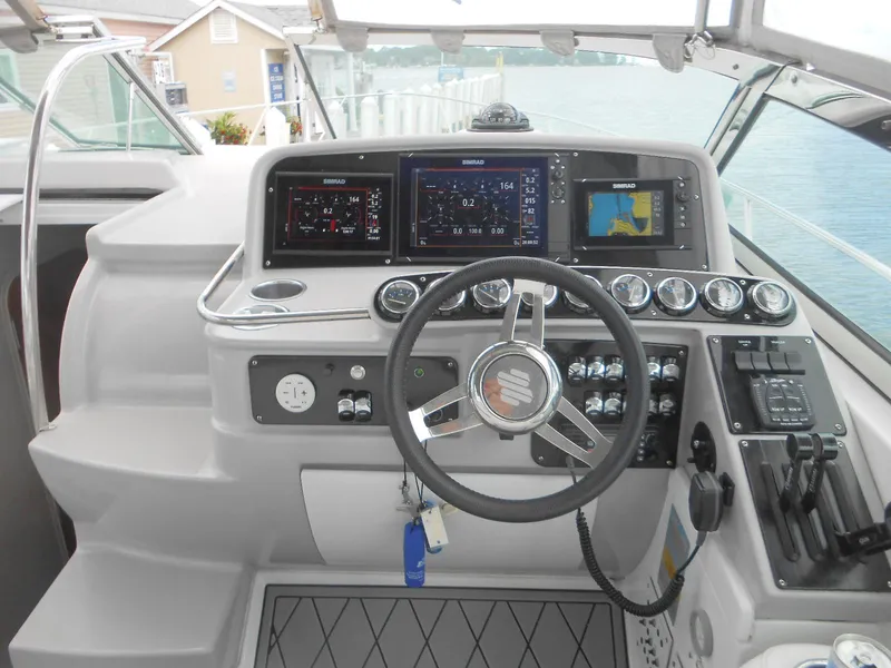 Slide: The Image of 2004 Formula 37 PC yacht helm with advanced navigation controls and steering wheel. - 15