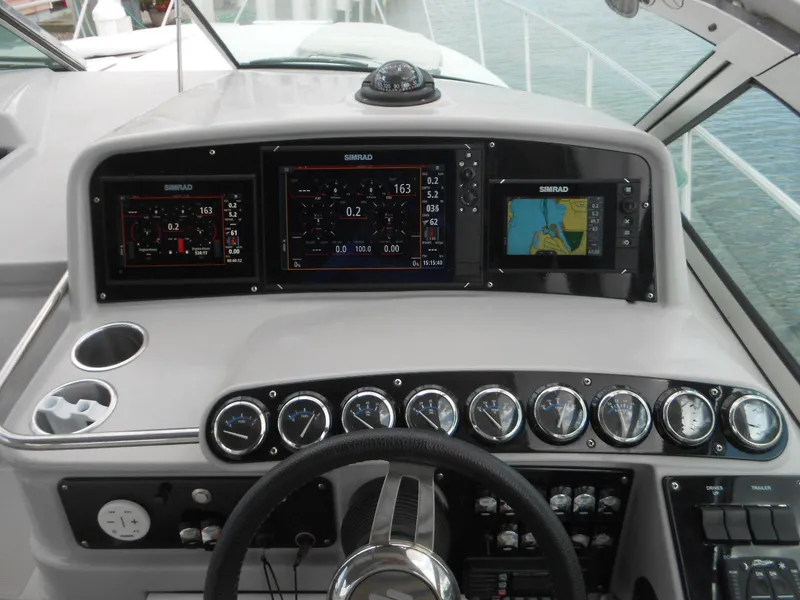 Slide: The Image of Control panel of a 2004 Formula 37 PC boat with navigation displays. - 17