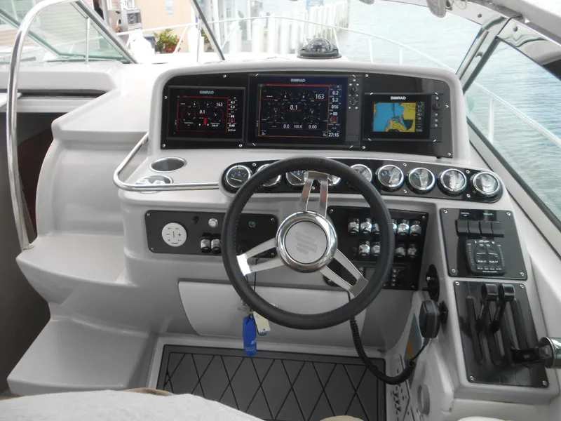Slide: The Image of 2004 Formula 37 PC boat helm with modern navigation and control systems. - 18