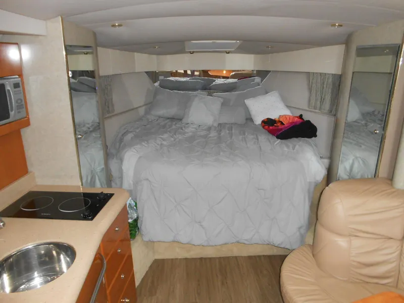 Slide: The Image of Interior of 2004 Formula 37 PC yacht with cozy bed, kitchenette, and seating area. - 3