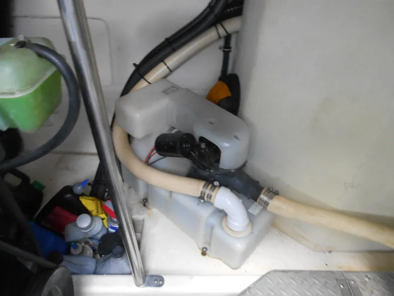 Slide: The Image of 2004 Formula 37 PC boat engine compartment with hoses and equipment. - 30