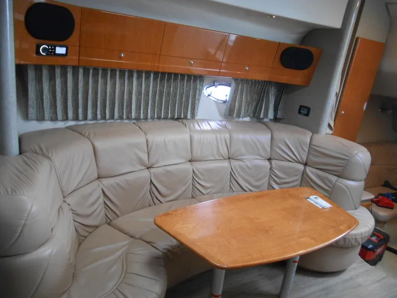 Slide: The Image of 2004 Formula 37 PC yacht interior with leather seating and wooden table. - 5