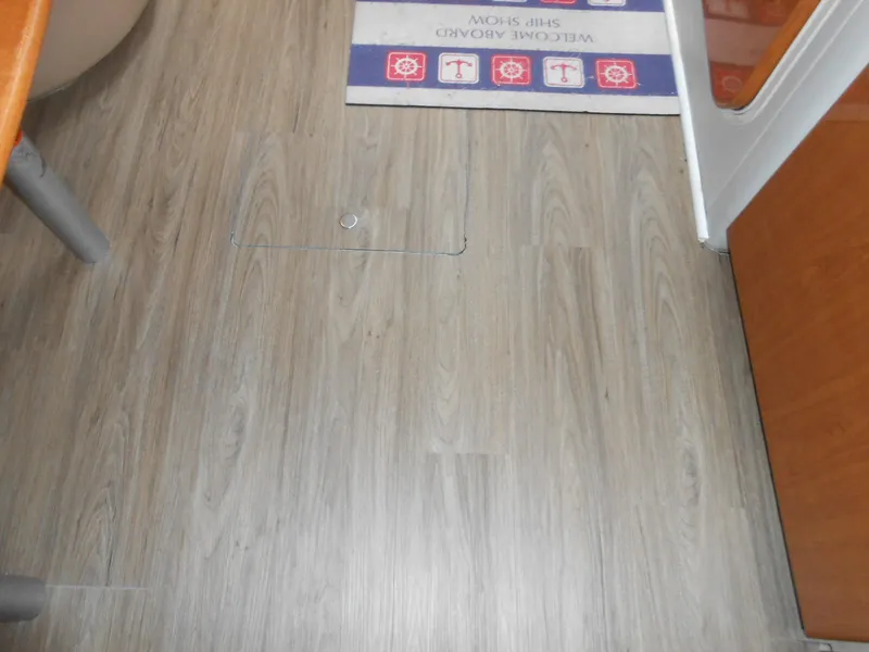 Slide: The Image of Wooden floor inside a 2004 Formula 37 PC boat cabin. - 6