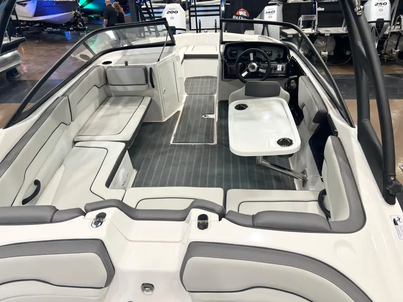 Slide: The Image of 2025 Yamaha Boats AR190 interior with seating and table, showcasing modern design and functionality. - 3