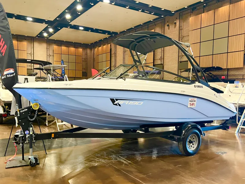 Slide: The Image of 2025 Yamaha Boats AR190 displayed indoors on a trailer. - 4