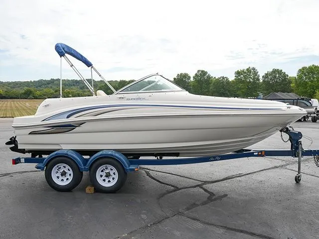 Slide: The Image of 2001 Sea Ray 190 Sundeck boat on trailer, parked outdoors. - 5