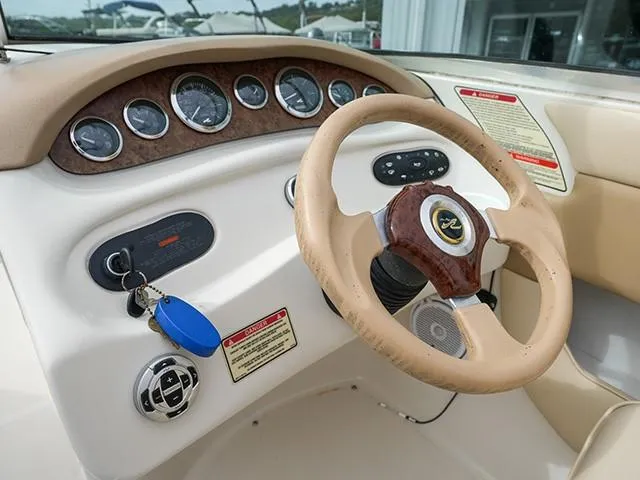 Slide: The Image of 2001 Sea Ray 190 Sundeck dashboard with steering wheel and instrument panel. - 8