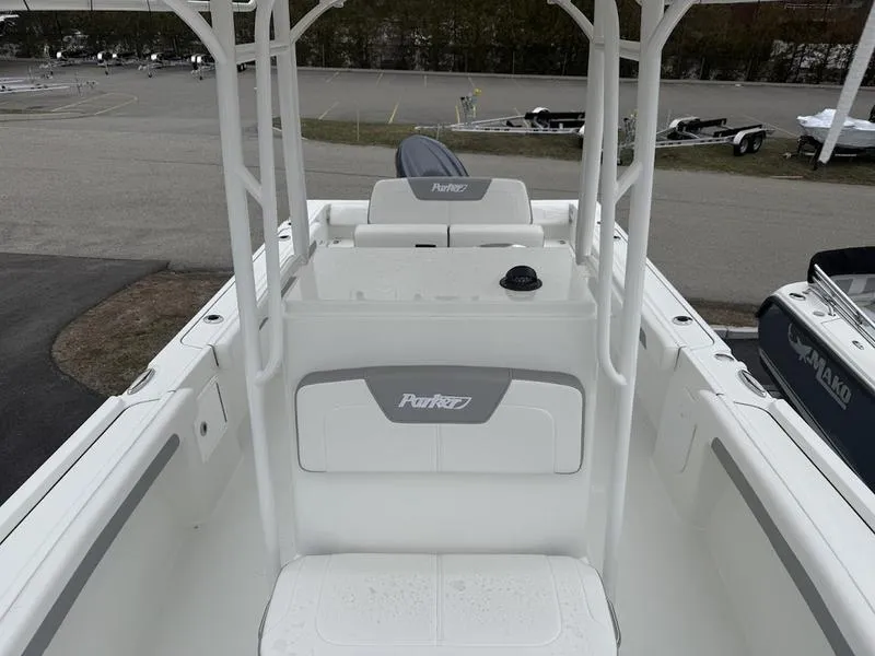 Slide: The Image of 2025 Parker 21 SE CC boat interior, featuring sleek white design and spacious seating. - 12