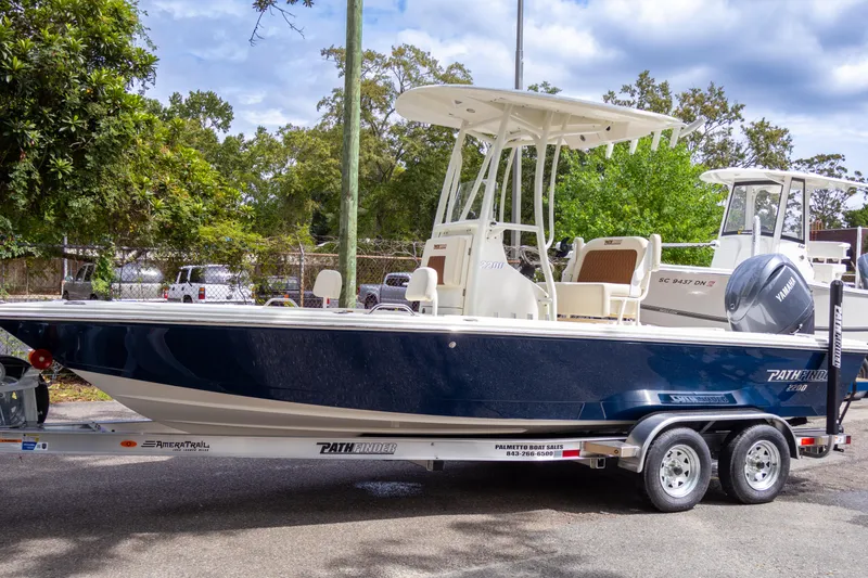 The Image of 2025 Pathfinder 2200 TRS boat on trailer, parked outdoors. - 0