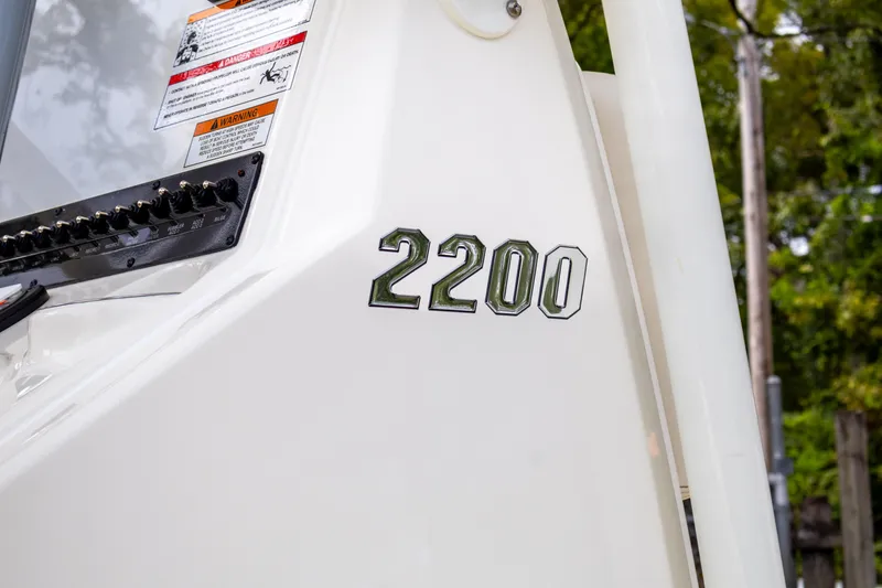 Slide: The Image of Close-up of 2025 Pathfinder 2200 TRS boat model number on white surface. - 12