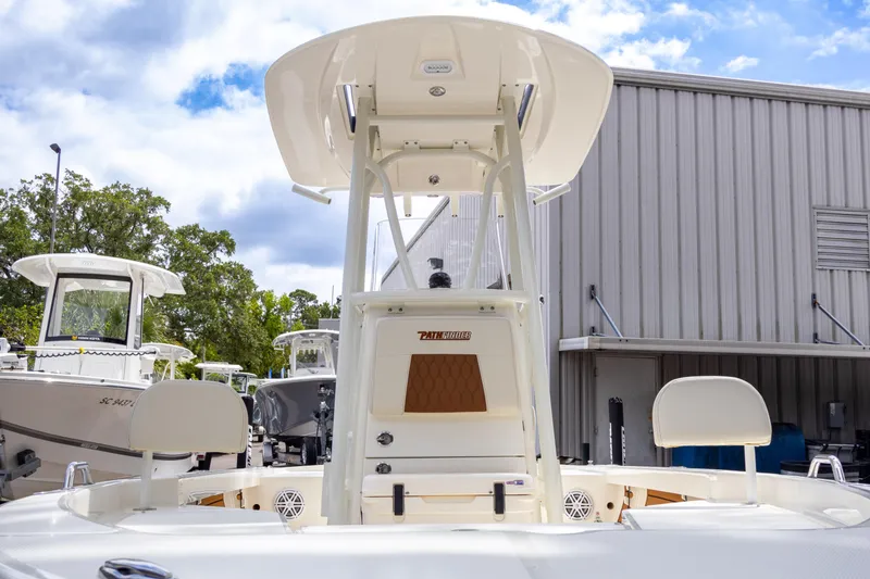 Slide: The Image of 2025 Pathfinder 2200 TRS boat, docked outdoors, with clear sky background. - 14