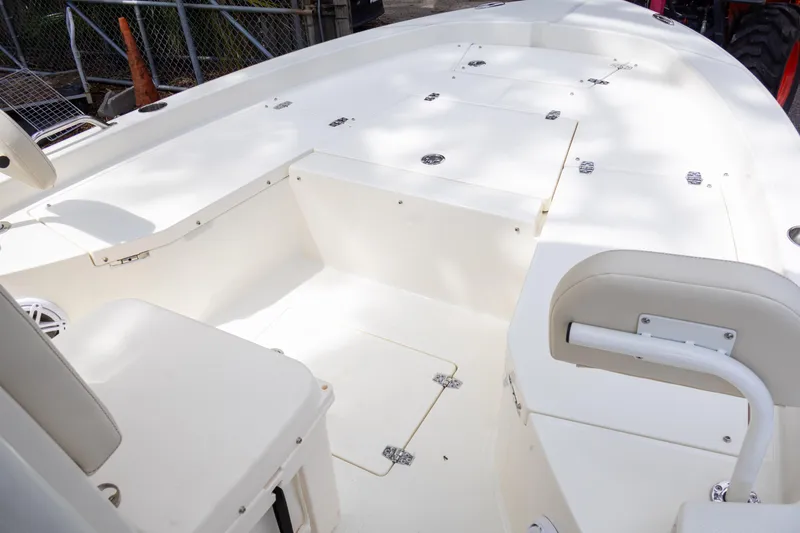 Slide: The Image of 2025 Pathfinder 2200 TRS boat interior with spacious seating and storage compartments. - 20