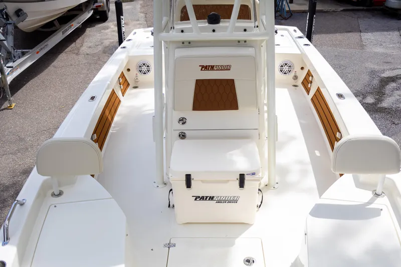 Slide: The Image of 2025 Pathfinder 2200 TRS boat interior with seating and storage compartments. - 21