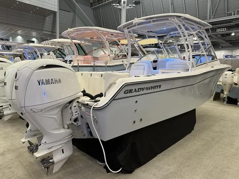 Slide: The Image of 2025 Grady-White Freedom 275 boat with Yamaha engine displayed indoors. - 3