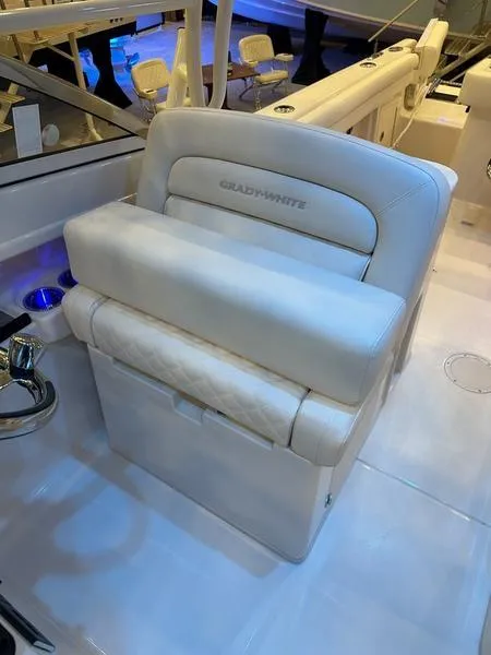 Slide: The Image of 2025 Grady-White Freedom 275 boat seat, luxurious white upholstery, modern design. - 7