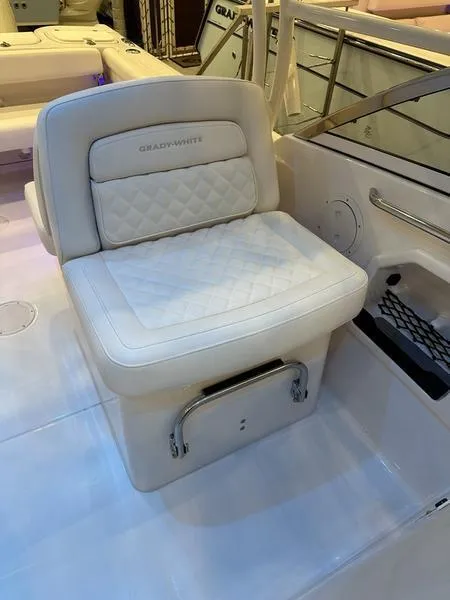 Slide: The Image of 2025 Grady-White Freedom 275 boat seat with quilted design and storage compartment. - 8