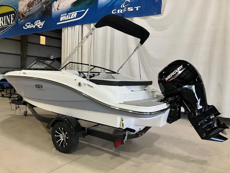 Slide: The Image of 2025 Sea Ray SPX 190 Outboard boat with Mercury engine in showroom. - 4